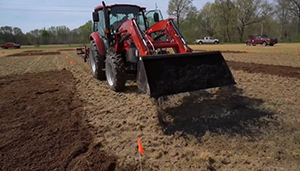 picture of tractor spreading biochar